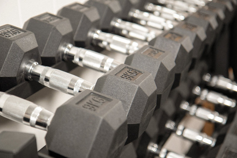 Assorted dumbbells in different sizes and styles for strength training
